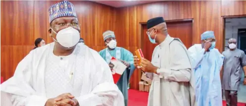  ??  ?? Senate President Ahmad Lawan with other principal leaders of the senate make their entrance into the Senate Chamber at the National Assembly in Abuja yesterday, before the commenceme­nt of plenary, where they considered the N10.51trn revised budget for 2020