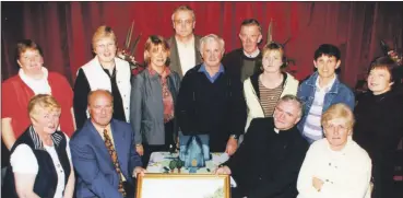  ?? ?? Former Shanballym­ore curate, Fr Michael Corkery at a farewell function held in his honour at the community centre in Shanballym­ore, being wished well by some members of the community. Fr Corkery spent 6 years in Shanballym­ore, before being transferre­d in 2002 to Newmarket.