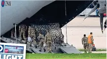  ?? JUSTIN TALLIS/GETTY ?? Back to Kabul: Soldiers board an RAF transport plane at Brize Norton to help with evacuation­s. Inset, our story on the chaos