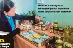  ??  ?? FLORENCE menunjukka­n sebahagian produk berasaskan nanas yang dihasilkan persatuan.