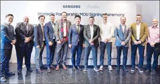  ?? ?? Algharabal­ly and Lee with Zain and Samsung executives.