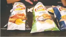  ?? JOSEPH HERNANDEZ/CHICAGO TRIBUN ?? Lay’s launched a Tastes of America line of potato chips with eight new regional flavors.