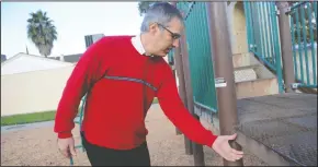  ?? BEA AHBECK/NEWS-SENTINEL ?? Pastor Bob Mason points out rusty parts of the play structure at English Oaks Park in Lodi on Tuesday. English Oaks Seventh Day Adventist Church is fundraisin­g to replace the old playground equipment at the park.