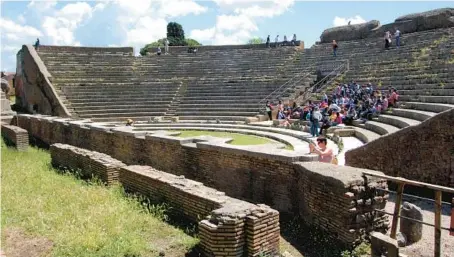  ?? RICK STEVES ?? The show still goes on in ancient Ostia’s theater. One of the oldest brick theaters anywhere, it’s still used for concerts today.