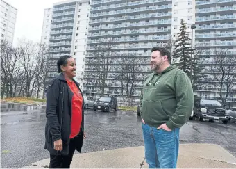  ?? DAN PEARCE TORSTAR ?? Tigist Moges, a resident and West Scarboroug­h Neighbourh­ood Community Centre employee, talks with executive director Josh Hood, who says many newcomers don’t know how to get recreation for their kids.