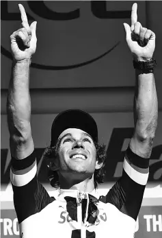  ??  ?? Stage winner Australia’s Michael Matthews celebrates on the podium after winning the 181.5 km fourteenth stage of the 104th edition of the Tour de France cycling race on July 15, 2017 between Blagnac and Rodez. - AFP photo