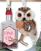  ?? ?? LEFT: George pink gin Christmas bauble
£3, Direct.asda
Did somebody say gin-gle bells? George festive owl bauble
£4, Direct.asda
What a hoot! We adore this little fellow and its blingy wing. The perfect addition to your Christmas tree decoration­s