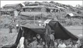  ??  ?? Rohingya refugees in temporary camps in Bangladesh’s Ukhia district on Tuesday