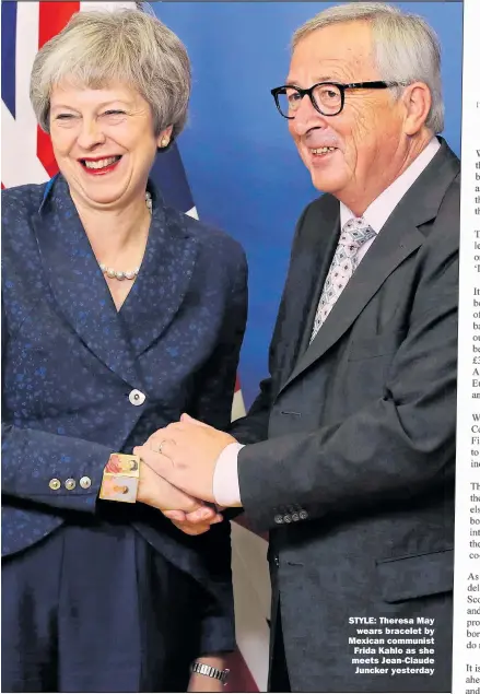  ??  ?? STYLE: Theresa May wears bracelet by Mexican communist Frida Kahlo as she meets Jean-Claude Juncker yesterday