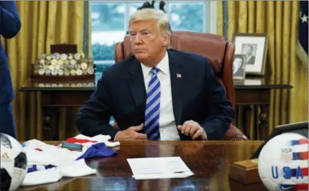  ?? EVAN VUCCI — THE ASSOCIATED PRESS ?? President Donald Trump listens to a question during a meeting with FIFA president Gianni Infantino and United States Soccer Federation president Carlos Cordeiro in the Oval Office of the White House, Tuesday in Washington.