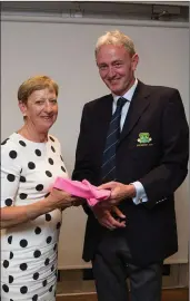  ??  ?? President’s Prize competitio­n winner Eileen Morton receives her prize from Club President Terence Ryan at Blainroe Golf Club.