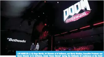  ??  ?? LOS ANGELES: (L-R) Hugo Martin, Art Director at Id Software, and Marty Stratton, Executive Producer and Game Director at Id Software, reveal ‘Doom Eternal’ during the Bethesda E3 conference at the Event Deck at LA Live. —AFP