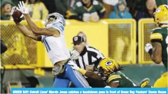  ?? — AP ?? GREEN BAY: Detroit Lions’ Marvin Jones catches a touchdown pass in front of Green Bay Packers’ Davon House during the first half of an NFL football game, in Green Bay.