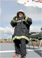  ?? SIMON O’CONNOR/STUFF ?? Ben Broadhurst, 11, tries on some firefighti­ng gear.
