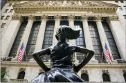  ?? BEBETO MATTHEWS — THE ASSOCIATED PRESS FILE ?? The “Fearless Girl” outside the New York Stock Exchange. Amid the push to get U.S. boardrooms to look more like companies’ customers and employees, advocates are finally seeing just how steep the task will be.