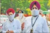  ?? RAVI KUMAR/HT ?? Rajya Sabha MPS Partap Singh Bajwa and Shamsher Singh Dullo coming out of Punjab Raj Bhavan in Chandigarh.