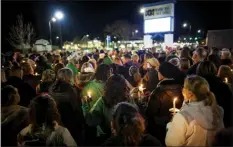  ?? AP photo ?? Residents of Newport News hold a candleligh­t vigil in honor of Richneck Elementary School first-grade teacher Abby Zwerner in Newport News, Va., on Monday. Zwerner was shot and wounded by a 6-year-old student while teaching class on Jan.6.