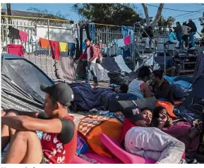  ?? — Bloomberg ?? Uncertain future: Migrants resting at an improvised refugee camp set up at the Benito Juarez sports centre in Tijuana.