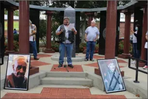  ?? The Sentinel-Record/ Tanner Newton ?? HONOR RIDE: Terry Massey, president of Arkansas Honor Ride, speaks after their annual motorcycle parade. This year the event was in honor of Navy veteran Benjamin Haymon, pictured left, and Army veteran Jack Milton, pictured right.