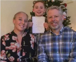  ??  ?? ‘Superhero’: Deirdre, her son Andy, 8, with his letter, and brother David