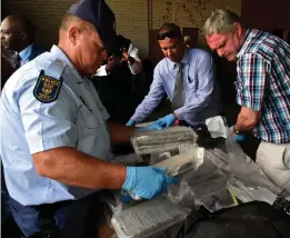  ?? Picture: EUGENE COETZEE ?? HELL HAUL: A drug bust at the port of Ngqura on the outskirts of Port Elizabeth on Monday led to the seizure of cocaine with a street value of over R700m. The bust was carried out by a specialise­d police unit in the Hawks in conjunctio­n with other police units. Members of the Hawks, both national and provincial, swooped on the port following a tip-off from Interpol in December. Once on board officers found the cocaine stashed well below the deck. In total, the cocaine is worth about R720m on the streets.