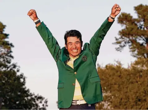  ?? Gregory Bull / Associated Press ?? Hideki Matsuyama of Japan celebrates putting on the champion’s green jacket after winning the Masters golf tournament on Sunday.