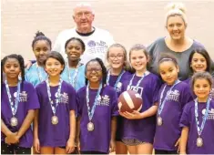  ?? Submitted photo ?? ■ Coach Gerald Ross Morgan and his daughter Missy Morgan Lyda pose with their youth volleyball team from New Boston this past fall.