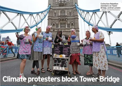  ?? IMAGE STEFAN ROUSSEAU ?? Extinction Rebellion members on Tower Bridge, central London