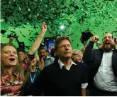  ?? PHOTO: REUTERS ?? Green vote: Leaders of the German Green party react to the first exit polls in the Bavarian state elections in Munich last night.