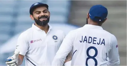  ??  ?? Virat Kohli and Ravindra Jadeja helped India to 601 for five in Pune