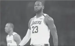  ?? GARY CORONADO/LOS ANGELES TIMES ?? Lakers forward LeBron James plays in a game against the Bucks in the first half at the Staples Center on March 6 in Los Angeles.