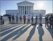  ?? J. SCOTT APPLEWHITE— ASSOCIATED PRESS ?? Anti- abortion activists with “Bound 4Life” demonstrat­e at the Supreme Court in Washington, Monday, Oct. 5, 2020, as the justices begin a newterm without the late Justice Ruth Bader Ginsburg.