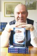  ??  ?? Paul Crampton with his latest book The Dream Messiah