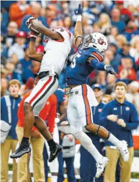  ?? THE ASSOCIATED PRESS ?? Georgia senior receiver Javon Wims, who had three catches for 96 yards in Saturday’s 40-17 loss at Auburn, wouldn’t mind seeing the Tigers again in the SEC championsh­ip game next month in Atlanta.
