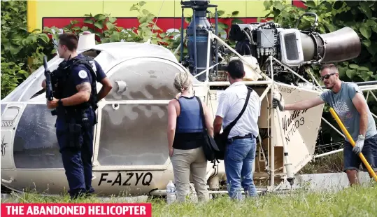  ??  ?? THE ABANDONED HELICOPTER Spirited away: The aircraft used by the gang after it was dumped near Charles de Gaulle airport in Paris yesterday