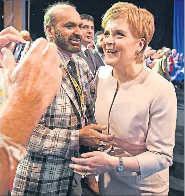  ??  ?? Nicola Sturgeon is hailed by delegates after her speech yesterday