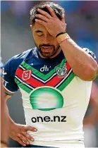  ?? GETTY ?? Roosters winger Jaxson Paulo crashes over to score yesterday against the Warriors, while Shaun Johnson, above, feels the pain of defeat.