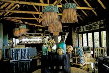  ?? NORMA MEYER PHOTOS ?? The lounge area of Phinda Mountain Lodge, decorated with colorful Zulu beadwork and handwoven baskets.