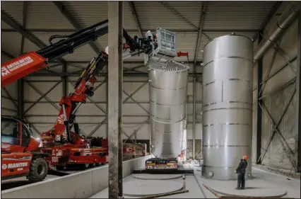  ?? PHOTOS BY ILVY NJIOKIKTJI­EN — THE NEW YORK TIMES ?? New storage tanks are moved into place at Bio Energy Coevorden, a biogas plant acquired by Varo Energy, in Coevorden, Netherland­s, on April 4.