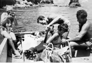  ??  ?? Top right: 1953 Guaymas, Mexico, Ernest adjusts his mother’s dive gear