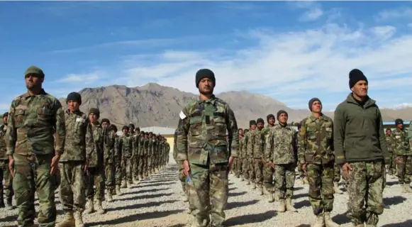  ?? TIM CRAIG/THE WASHINGTON POST ?? Elite Afghan soldiers stand in formation at the school of excellence at Camp Morehead, Afghanista­n, where commandos and special operations soldiers are trained.