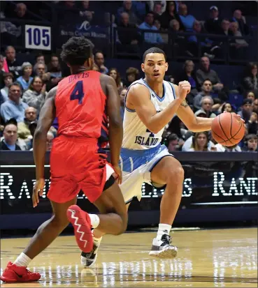  ?? Photo by Michael Derr / The Independen­t ?? Tyrese Martin (4) and Rhode Island struggled in nearly every aspect in Saturday’s 77-48 defeat to visiting Dayton. Martin was 2-for-8 from the field, as the Rams were an embarrassi­ng 16-for-54 from the field.