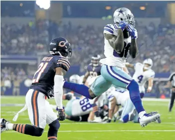  ?? RON JENKINS/ASSOCIATED PRESS ?? Dallas Cowboys’ wide receiver Dez Bryant catches a pass thrown by Dak Prescott for a touchdown. Bryant has a slight hairline fracture in a bone in his right knee, though coach Jason Garrett says the receiver might not miss a game.