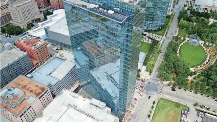  ?? [PHOTO PROVIDED] ?? The 27-story BOK Park Plaza Tower, seen in this aerial photo by CloudDeck Media, overlooks the Myriad Gardens and has views of the Oklahoma River, Bricktown, the state Capitol and the downtown skyline.