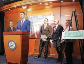  ?? PHOTO COURTESY OF CONGRESSMA­N RYAN COSTELLO’S OFFICE ?? U.S. Rep. Ryan Costello, R-6th Dist., speaks at a press conference announcing a Republican resolution recognizin­g climate change and calling for efforts to combat it. Third from the right is U.S. Rep. Brian Fitzpatric­k, R-8th Dist.