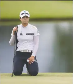  ?? NWA Democrat-Gazette/Jason Ivester ?? South Korean Sung Hyun Park eyes her putt on the 18th green during the Walmart NW Arkansas Championsh­ip at Pinnacle Country Club in Rogers. Park made nine birdies, four in a row on the front nine, and finished with an 8-under-par 63 for the early lead. LPGA Tour rookie Mel Reid was tied for second with a 66 highlighte­d by a hole-in-one at No. 11. See related story on Page 3B.