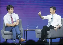  ?? COLE BURSTON / BLOOMBERG ?? Jack Ma, chairman of Alibaba Group, speaks with Prime Minister Justin Trudeau at the Gateway ’17 Canada conference in Toronto in late September. Trudeau has publicly courted a Canadian-Chinese friendship.