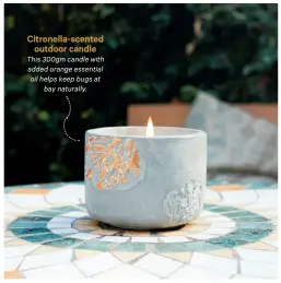  ??  ?? This 300gm candle with added orange essential oil helps keep bugs at bay naturally. Citronella-scented outdoor candle