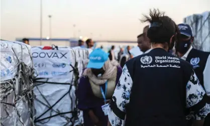  ??  ?? Coronaviru­s vaccine doses are unloaded from a plane at Khartoum airport in Sudan. Photograph: Anadolu Agency/Getty Images