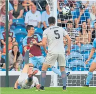  ??  ?? Ferguson scoring an overhead kick against Burnley in a Europa League second qualifying round tie in 2018